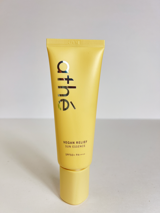 athé vegan sun essence comes in a yellow container with spf50+ PA++++