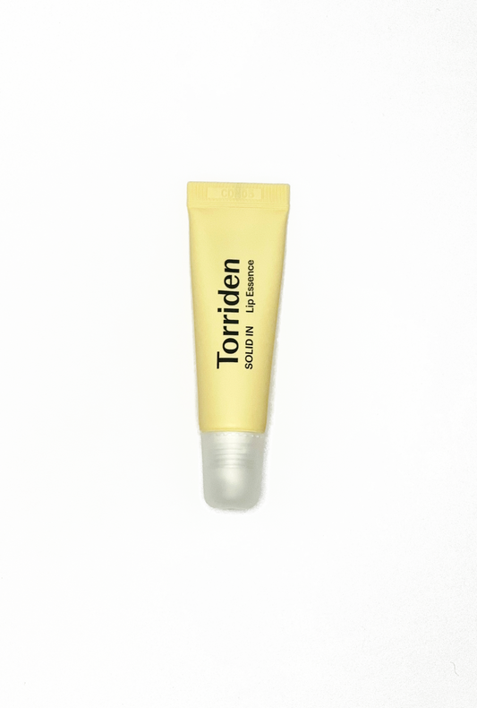 Torriden lip balm in a yellow tube.